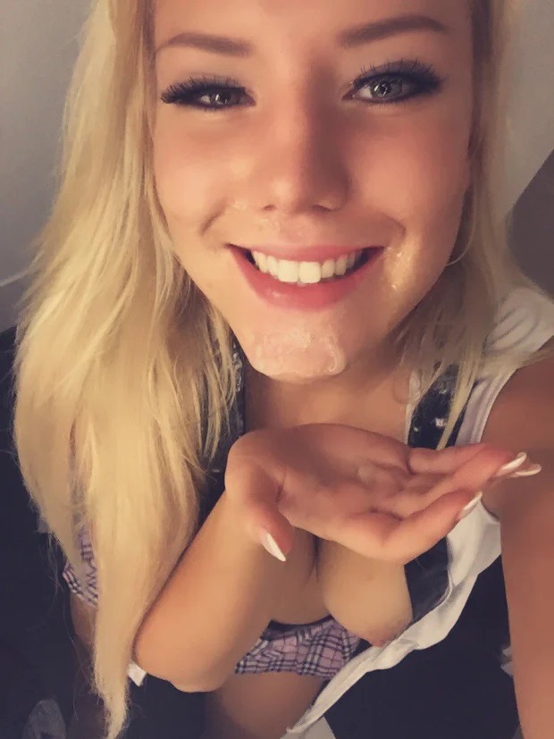 Beautiful blonde taking a selfie after a facial cumshot